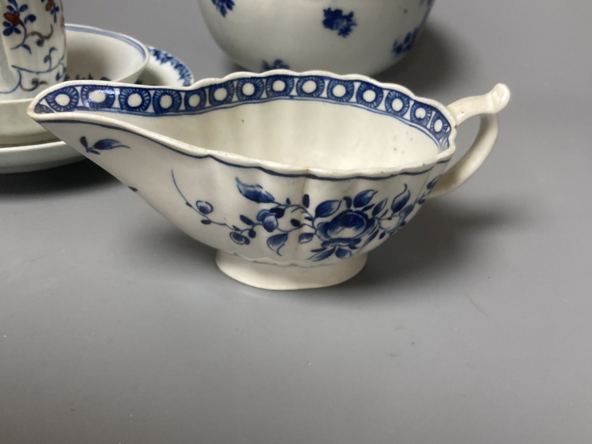 A group of Worcester blue and white ceramics, a Japan pattern cup and a Samson blue and white saucer, tallest 8cm